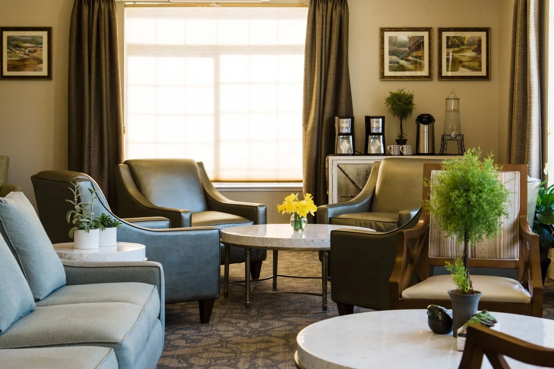 The Common area with great seating coffee and water available at Carefield Living Senior Living in Castro Valley