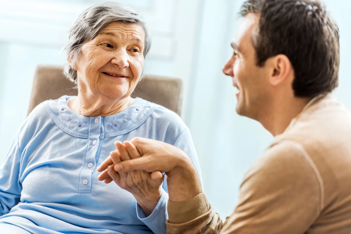 adult man visiting a loved one in memory care