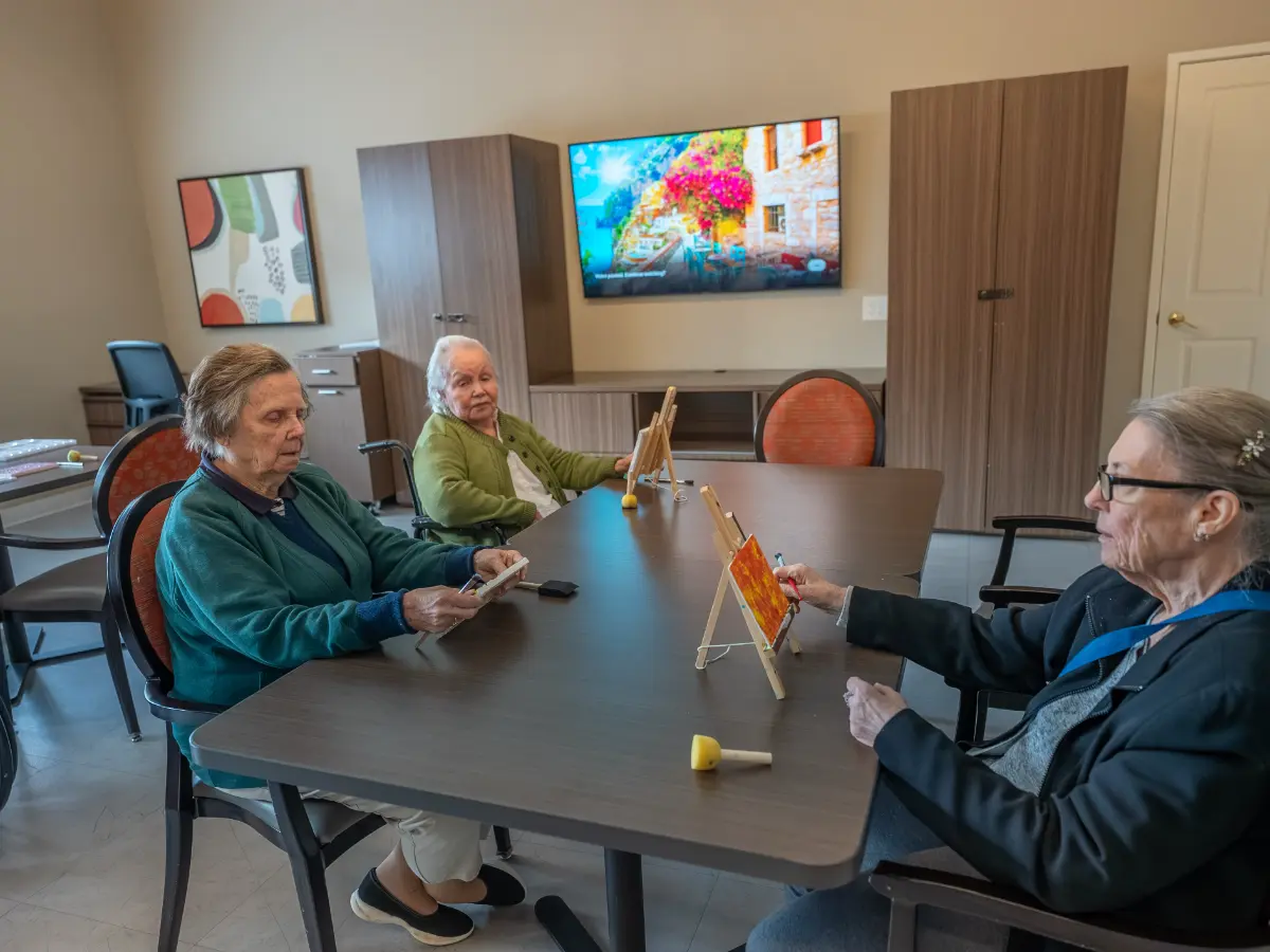 Carefield Pleasanton memory care senior living community residents enjoying creative activities in Pleasanton CA