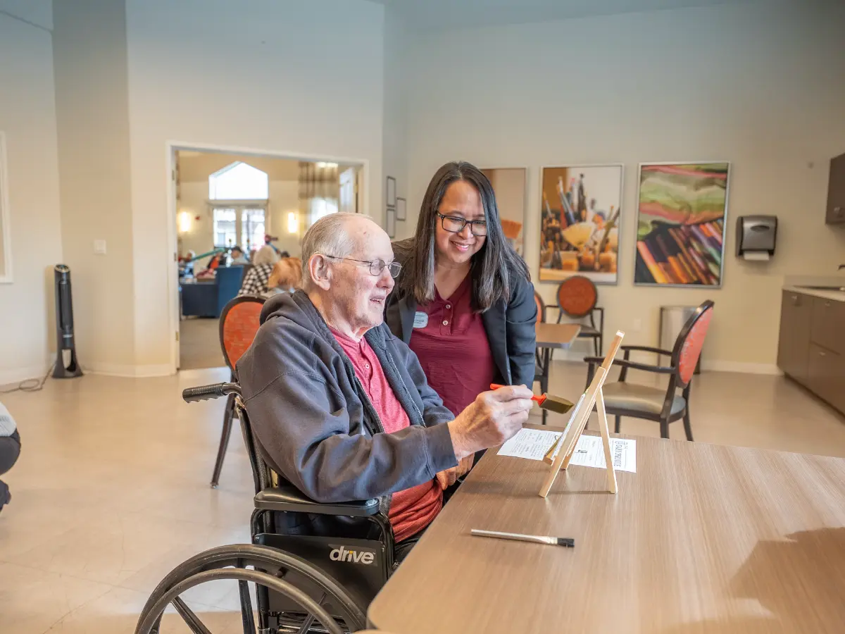 Carefield Pleasanton memory care senior living community staff supporting resident activity in Pleasanton CA