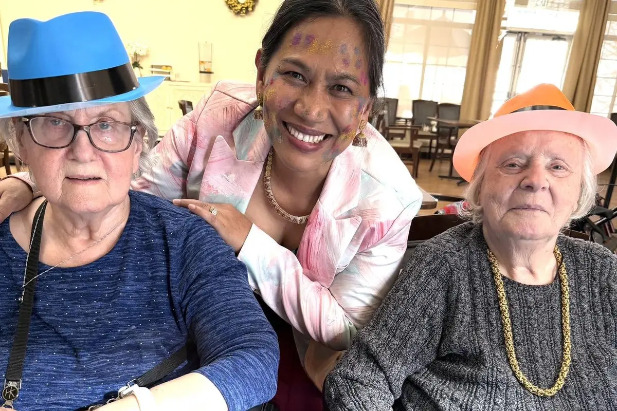Residents share a celebration as families plan ahead with a memory care waitlist