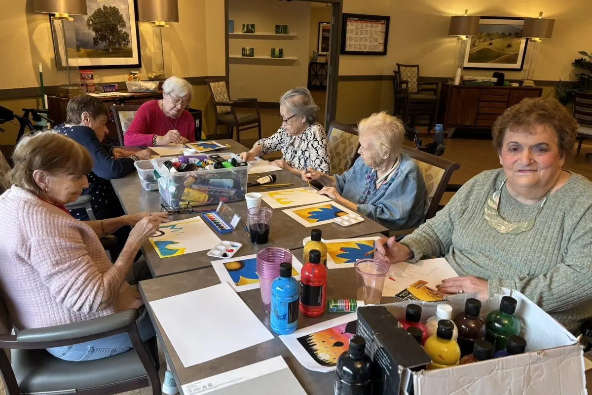 Assisted living and memory care residents enjoy a Sip and Paint activity at Madonna Gardens