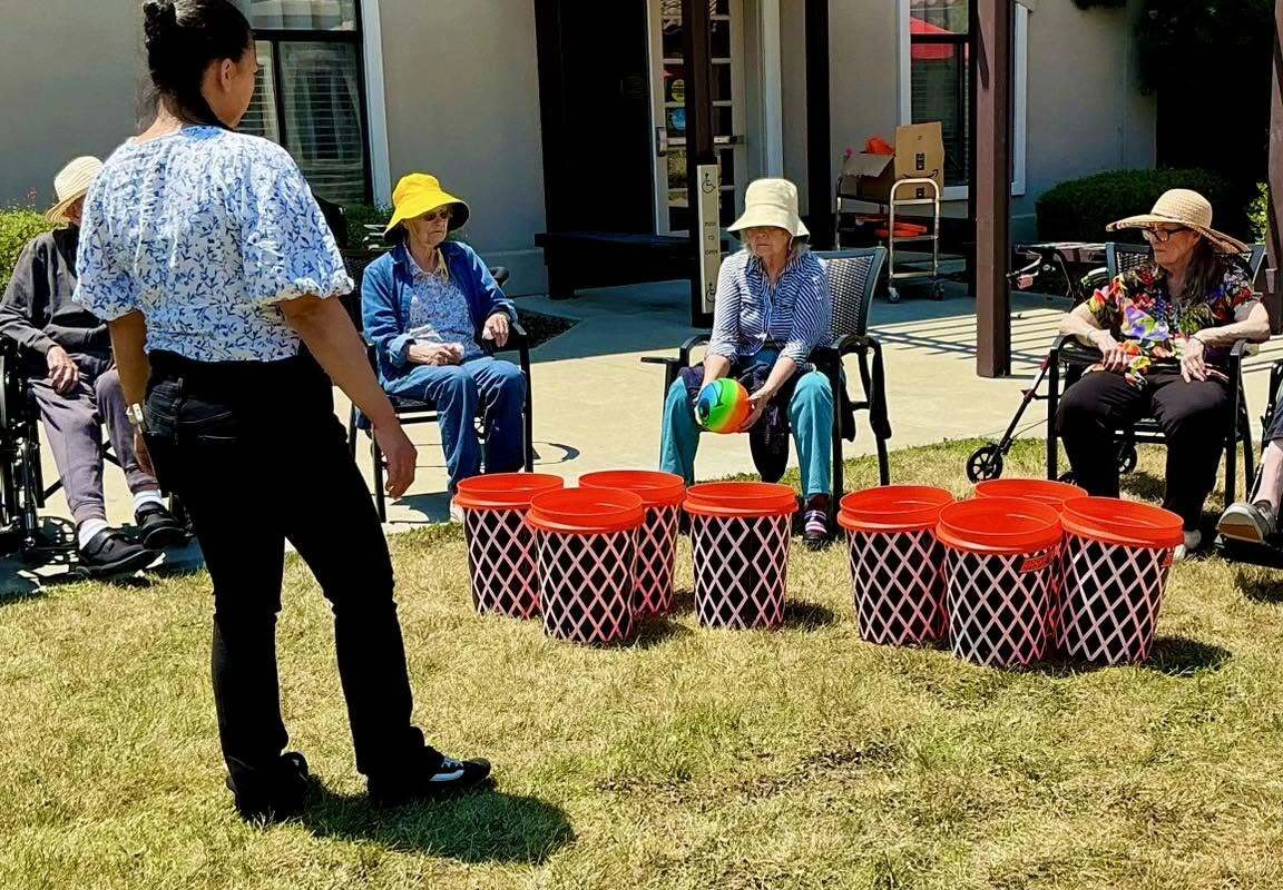 Memory care residents participating in engaging activities, representing a Memory care lifestyle program built around connection and purpose.