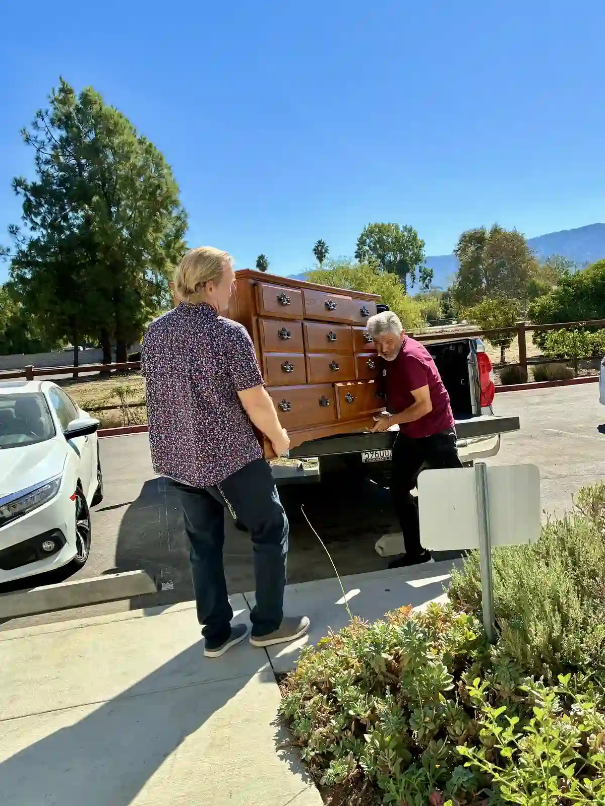 Ojai Meadows staff loading furniture into a truck to assist a senior moving from home ownership to senior living in Ojai.